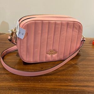 Coach puffy double zip camera bag. NWT. A few dents in the leather, shown.